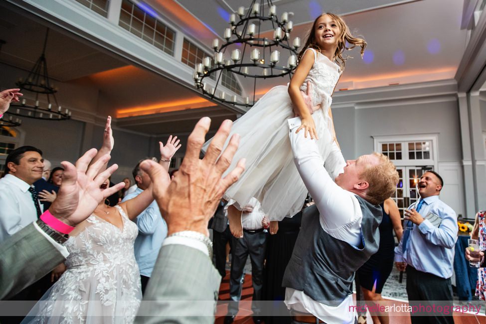 Park Avenue Club NJ wedding reception flower girl being raised up in the air by groom