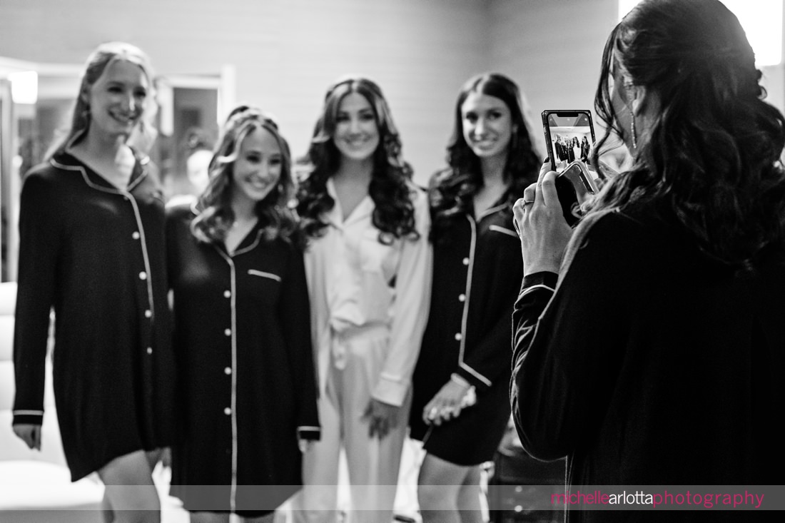 NJ bridesmaids pose for a photo in matching pajamas
