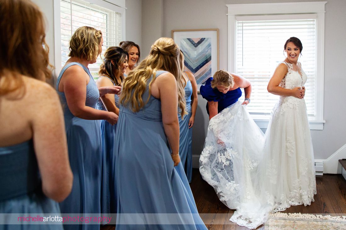 Phoenixville PA bride prep bride getting into wedding dress