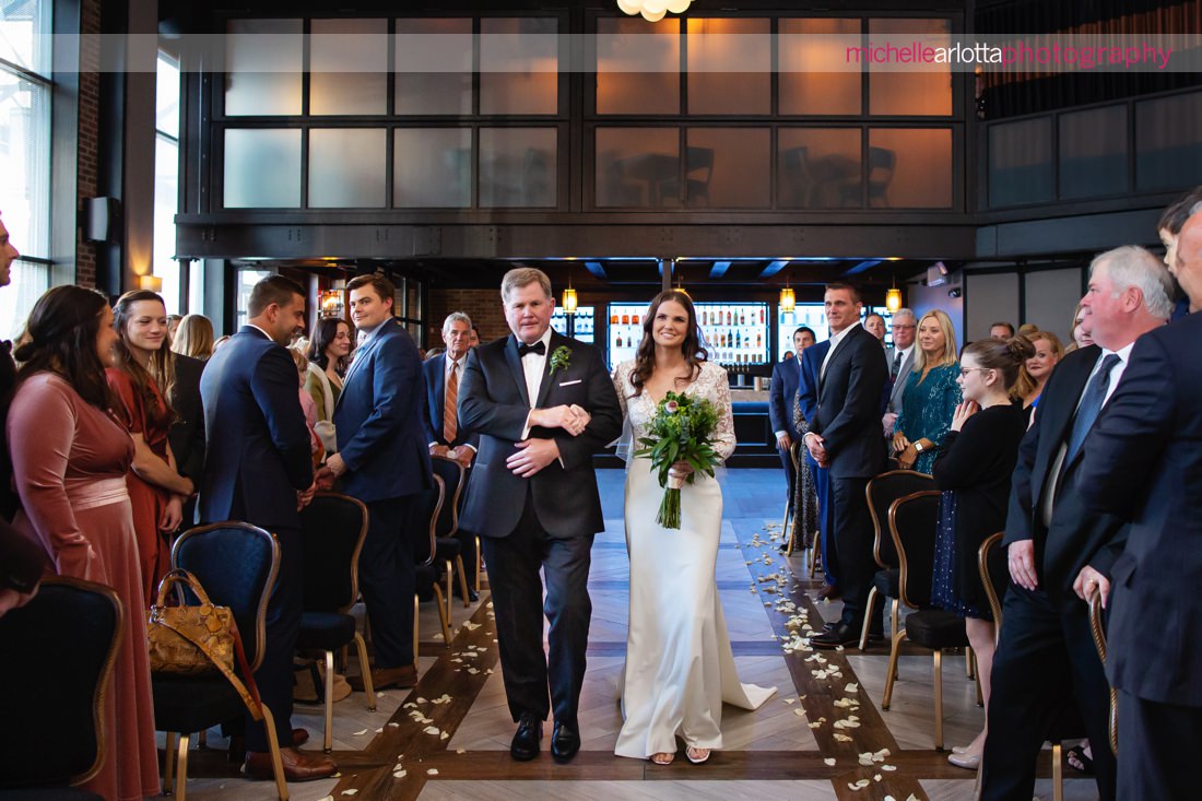 gallery at liberty prime jersey city indoor wedding ceremony bride walks down the aisle