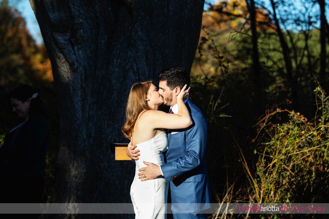 Hudson Valley NY outdoor wedding ceremony bride and groom kiss