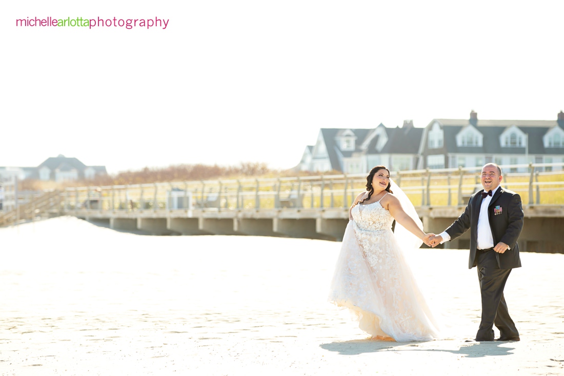 The Breakers by the ocean nj wedding bride and groom portrait on the beach