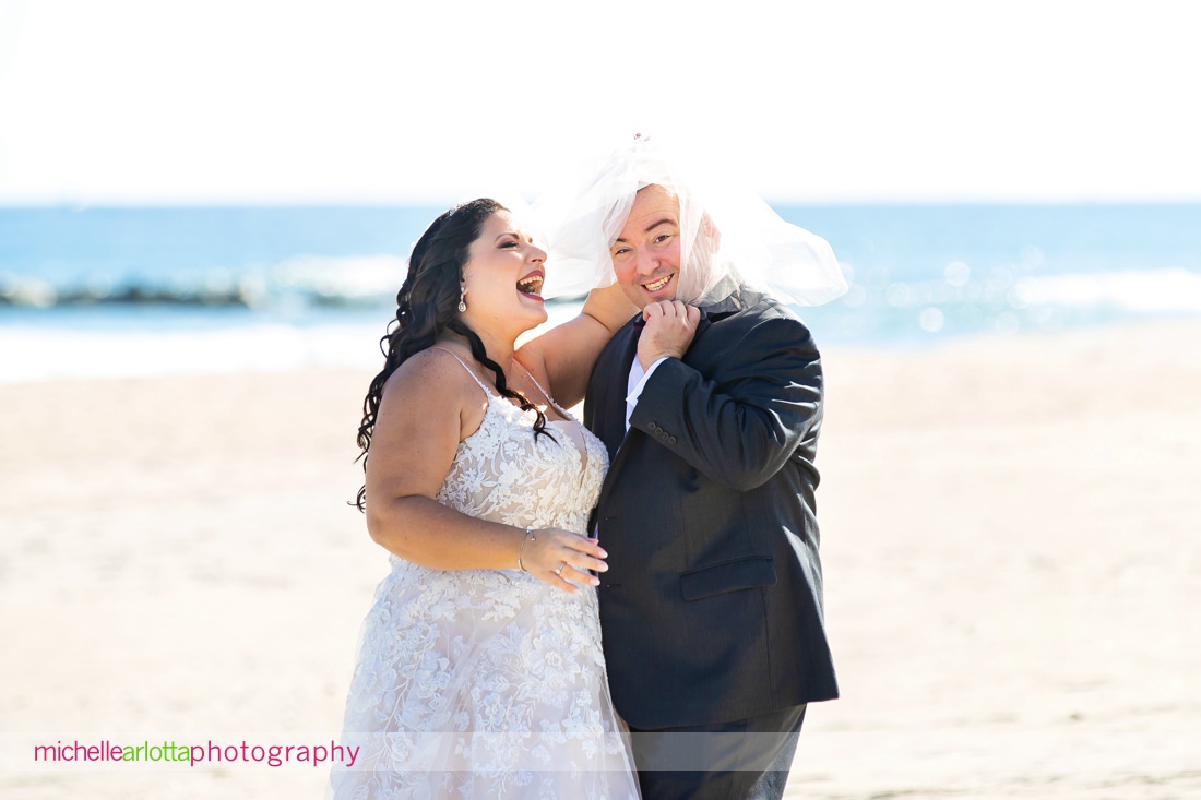 The Breakers by the ocean nj wedding groom pulls veil over head making fun