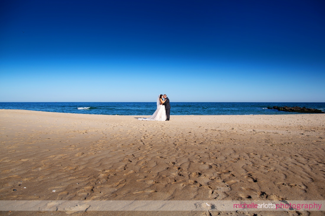 The Breakers by the ocean nj wedding bride and groom beach portraits