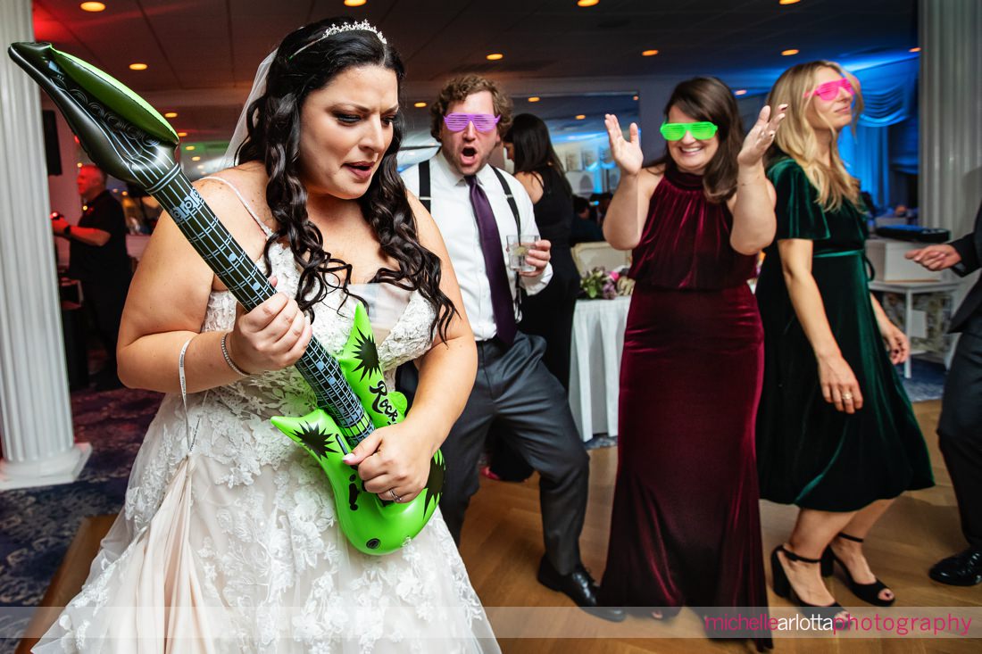The Breakers on the Ocean NJ wedding reception bride playing inflatable guitar