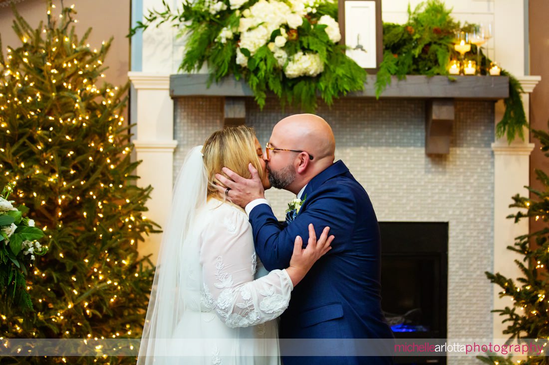 Hotel LBI indoor wedding ceremony NJ bride and groom kiss