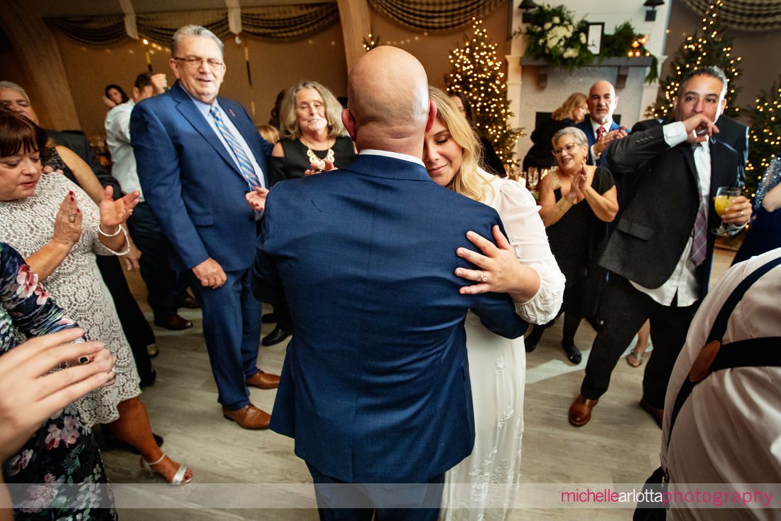 Hotel LBI wedding reception NJ dancefloor guests surround bride and groom during "Sweet Caroline"