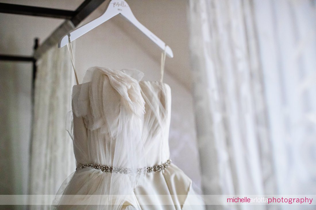 Vera wang wedding dress hanging in LBI Victorian inn