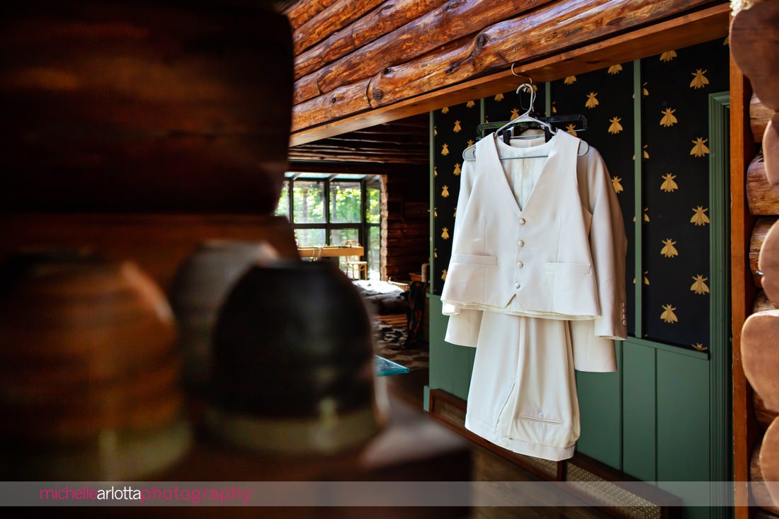 Bride's Bindle and Keep suit hanging at Grateful Woods Kerhonkson NY Airbnb
