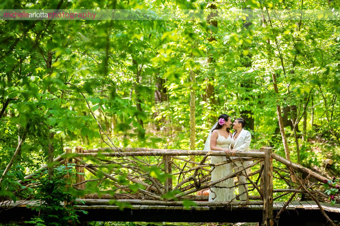 two brides in front of lily pond at Grateful Woods AirBnB Kerhonkson Hudson Valley wedding