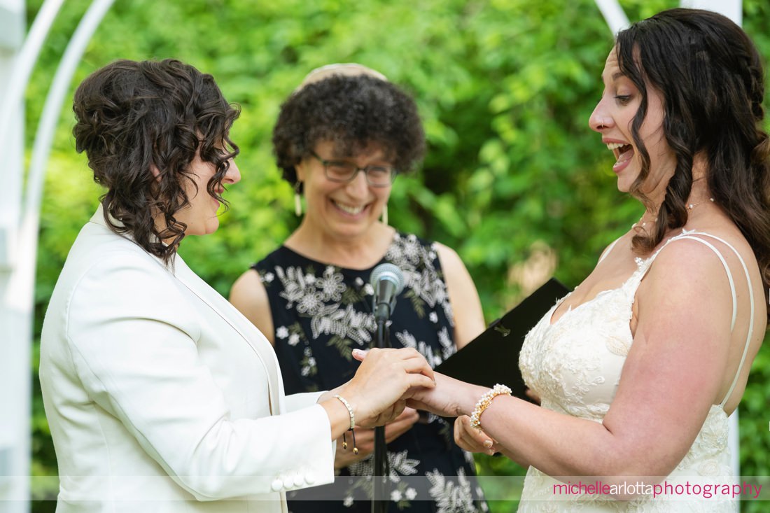 ring exchange with two brides during Garvan's Gastropub New Paltz NY