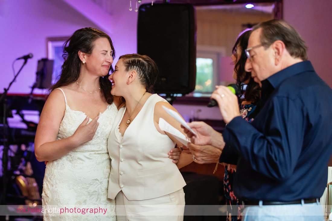 two bride's reacting during toasts Garvan's Gastropub in Hudson Valley NY