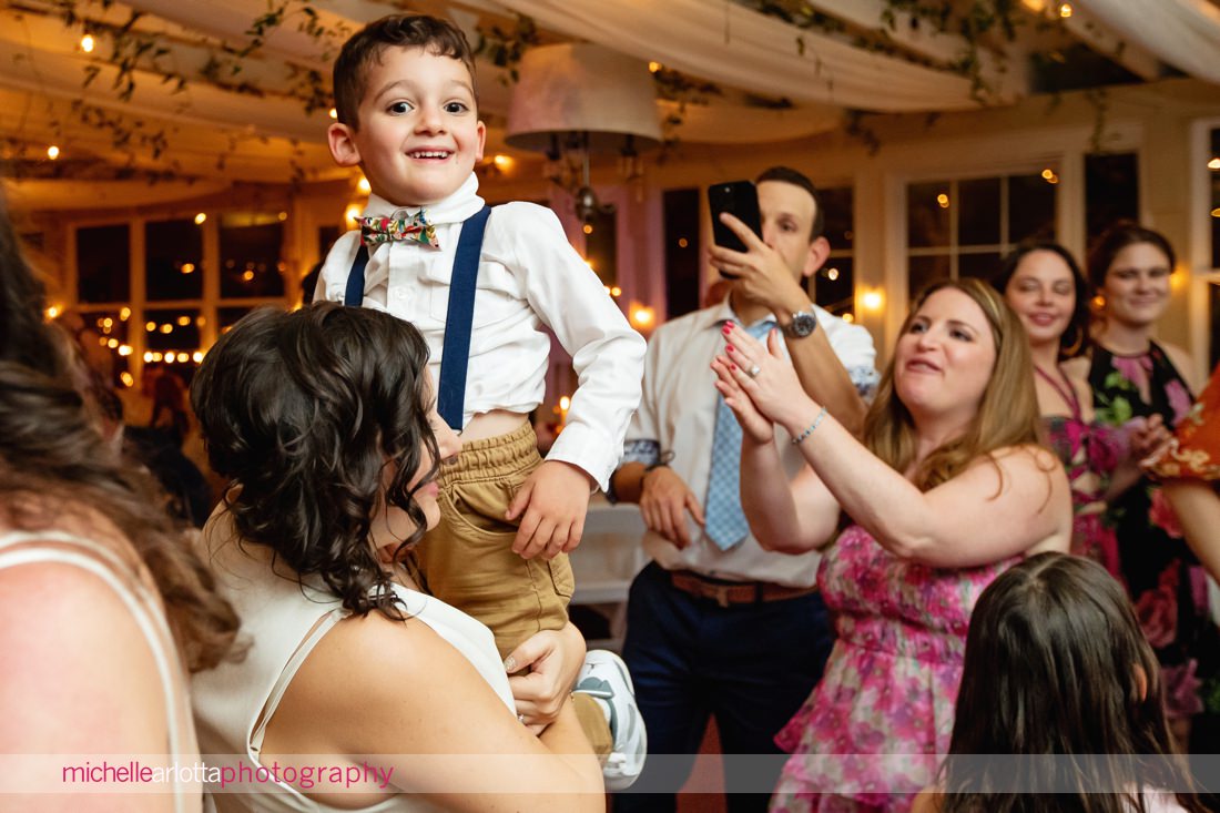wedding guests having fun during two bride's reacting during Garvan's Gastropub wedding reception in Hudson Valley NY