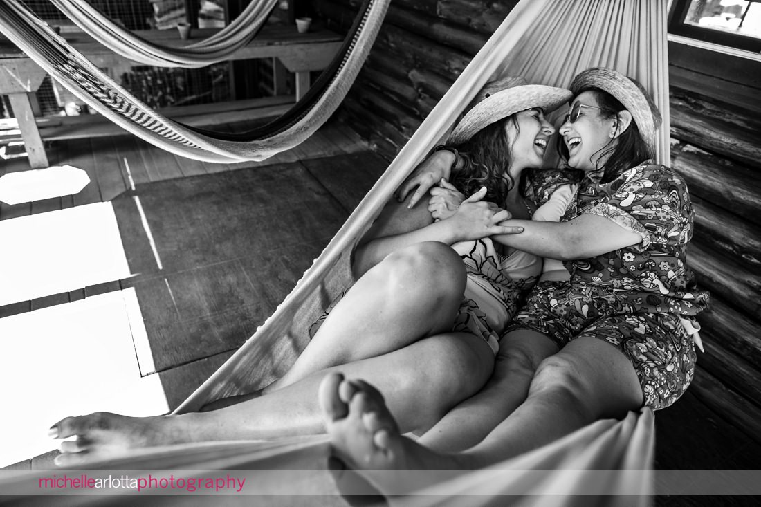 two brides-to-be in hammocks at Hudson Valley Grateful Woods AirBNB engagement session