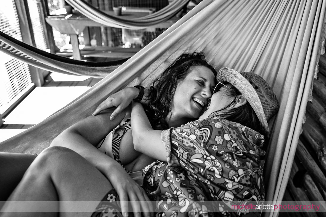 two brides-to-be in hammocks at Hudson Valley Grateful Woods AirBNB engagement session