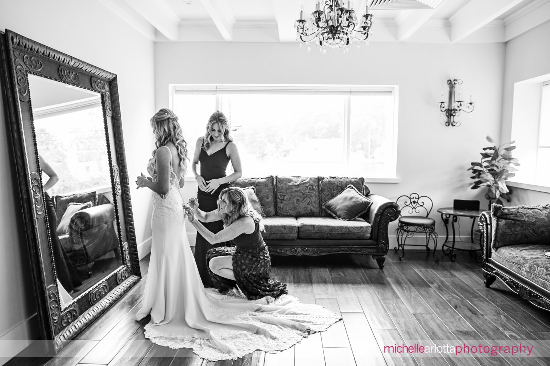 Perona Farms Refinery NJ bride getting ready mother and sister help with wedding gown
