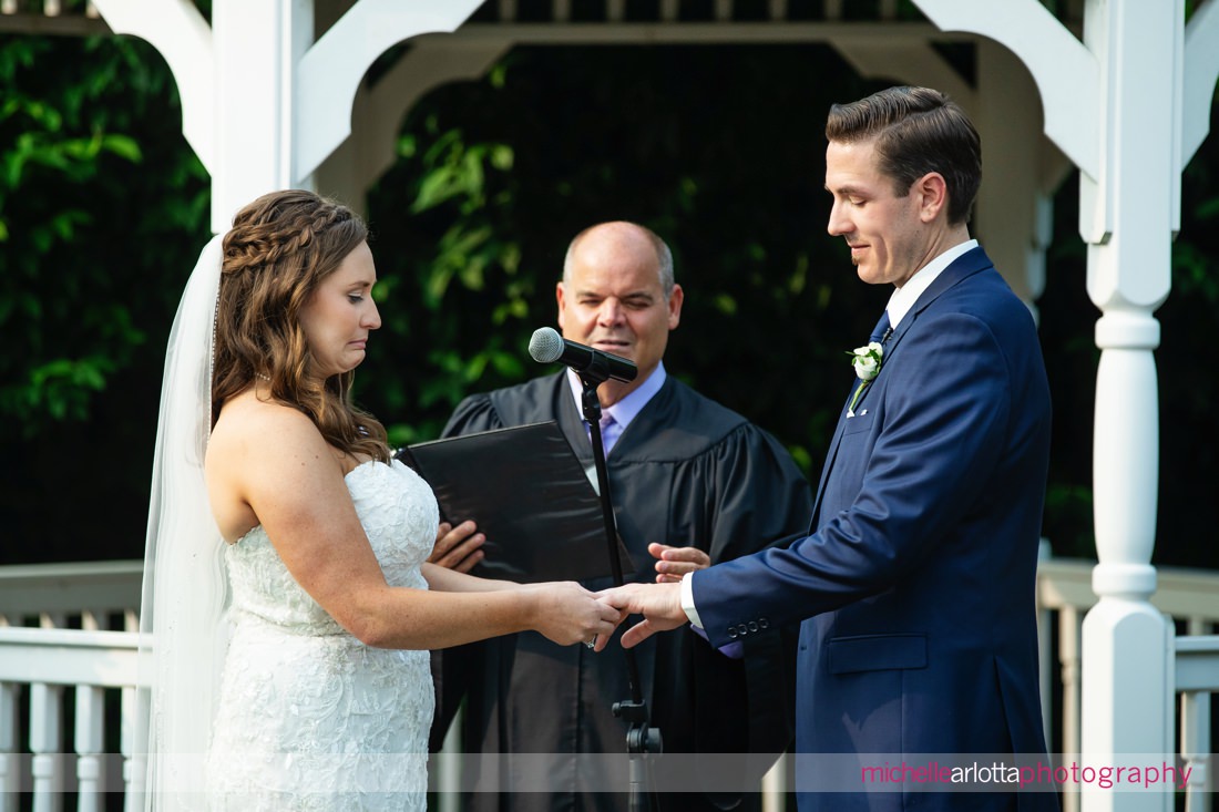 Outdoor ceremony at The Farmhouse NJ wedding ring exchange