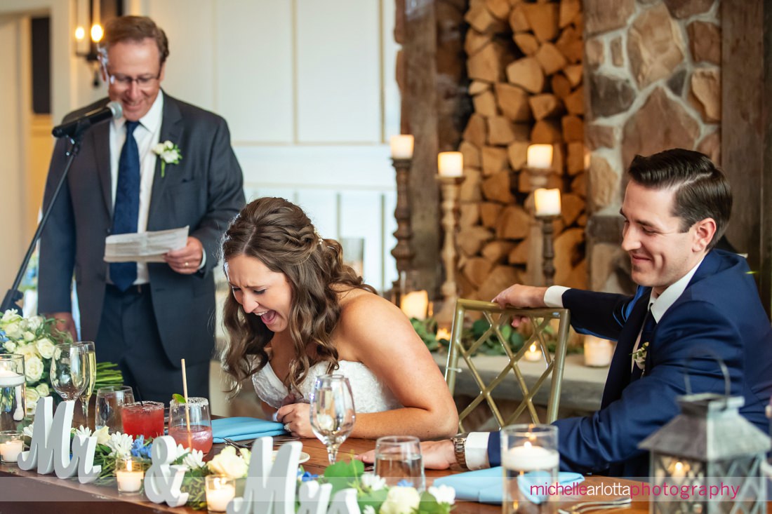The Farmhouse NJ summer wedding reception bride laughs during father's toast