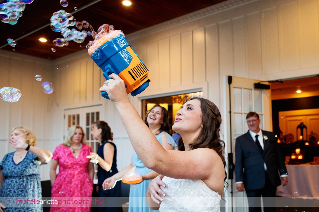 The Farmhouse NJ summer wedding reception bubble guns