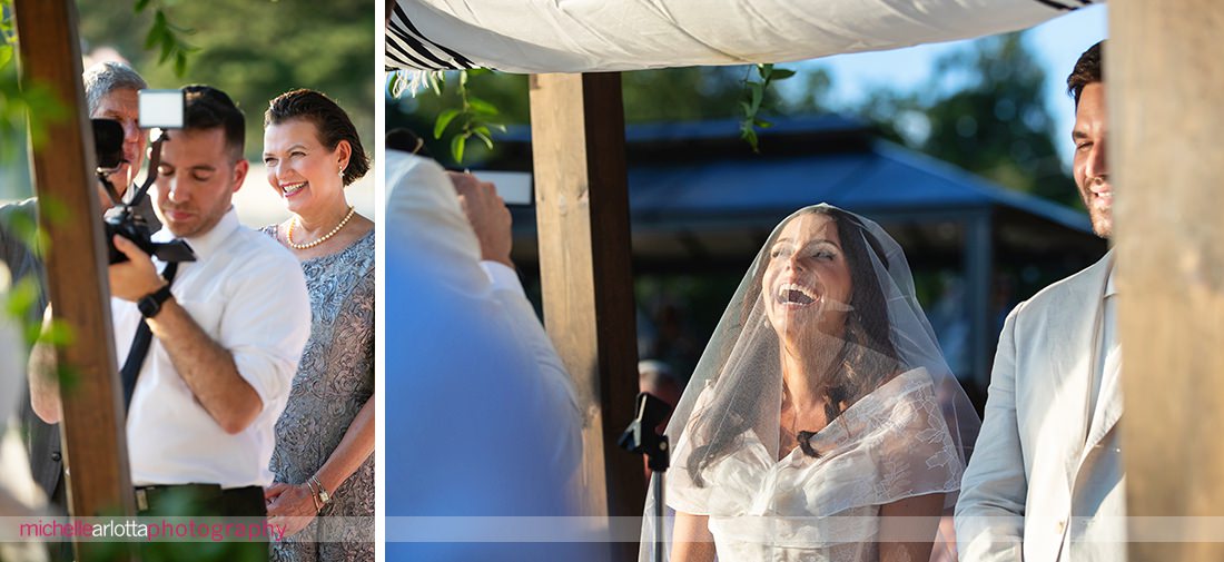 bride laughs under chuppah at jewish NJ Lake Mohawk Country Club lakeside wedding ceremony