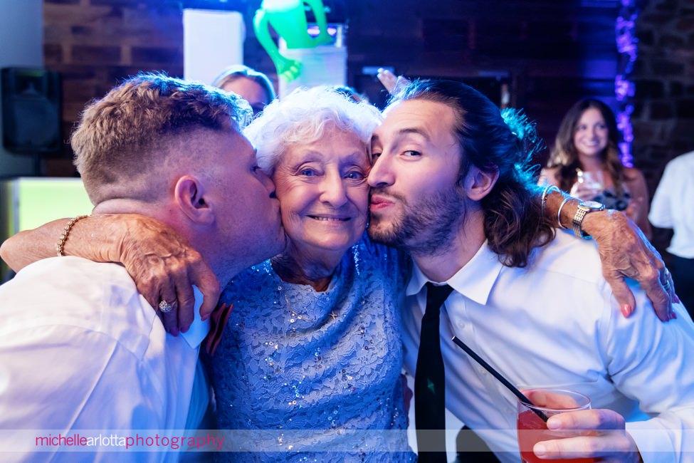 Logan Inn New Hope PA wedding reception grandmother getting kisses on her cheeks