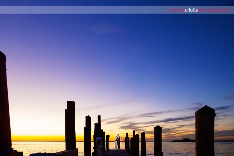 Parker's Garage LBI wedding bride and groom at sunset on the bay in New Jersey