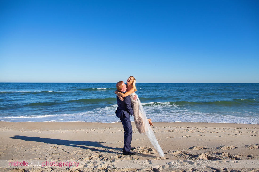 Parker's Garage LBI wedding groom picking up bride on beach in NJ