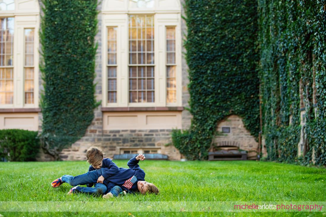 brothers wrestling during Princeton NJ family photo session