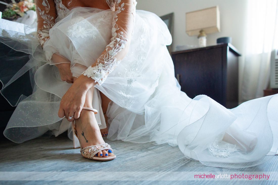 The Shore Club New Jersey bride putting on her shoes