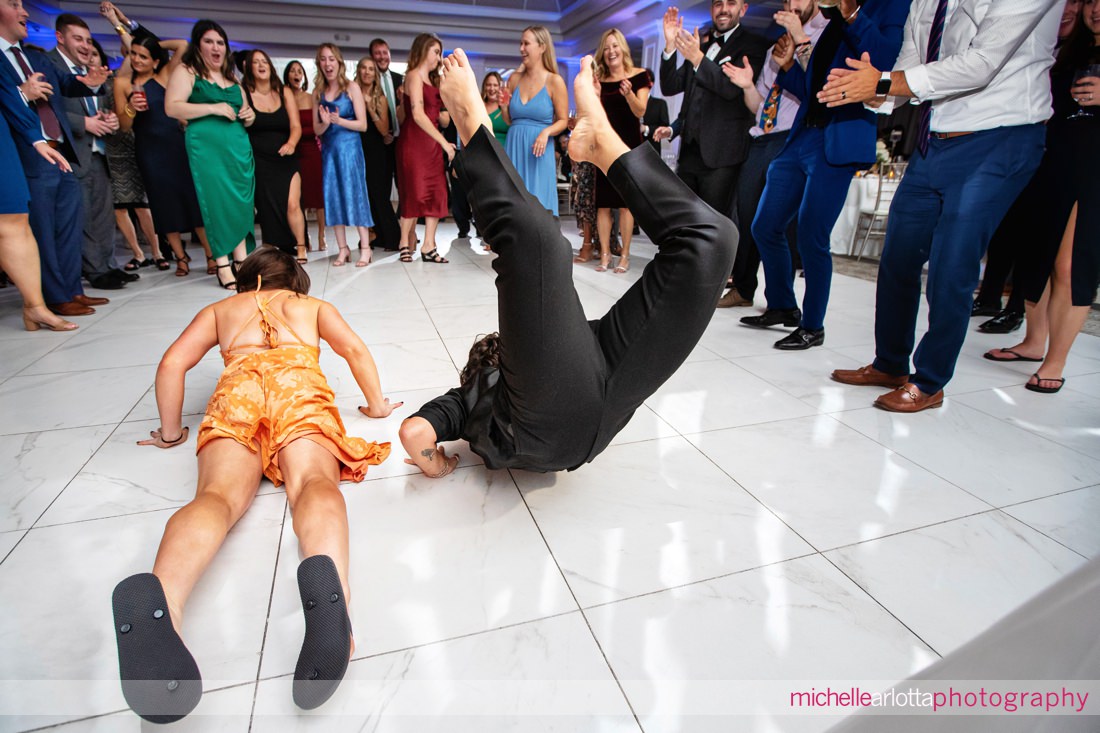 two wedding guests doing the worm at Edgewood country club nj wedding
