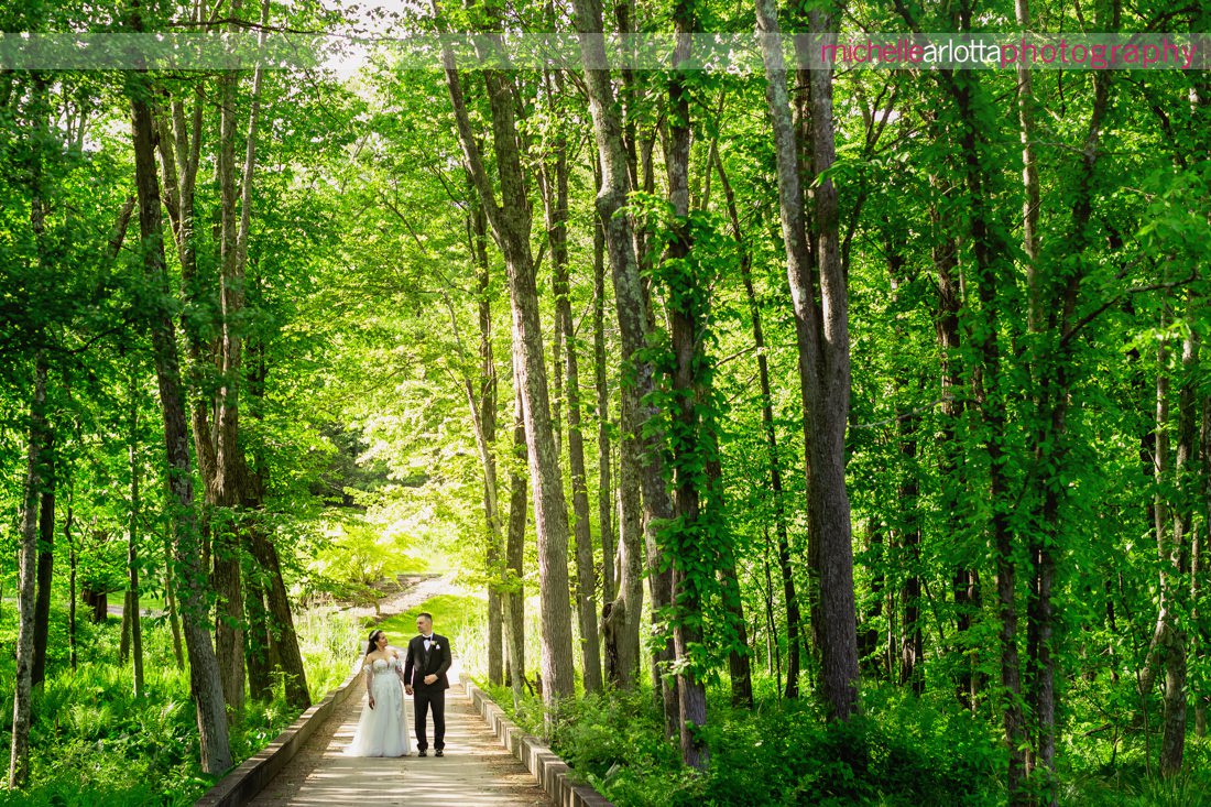 Venue at Winding Hills golf club wedding Montgomery New York bride and groom portrait on bridge