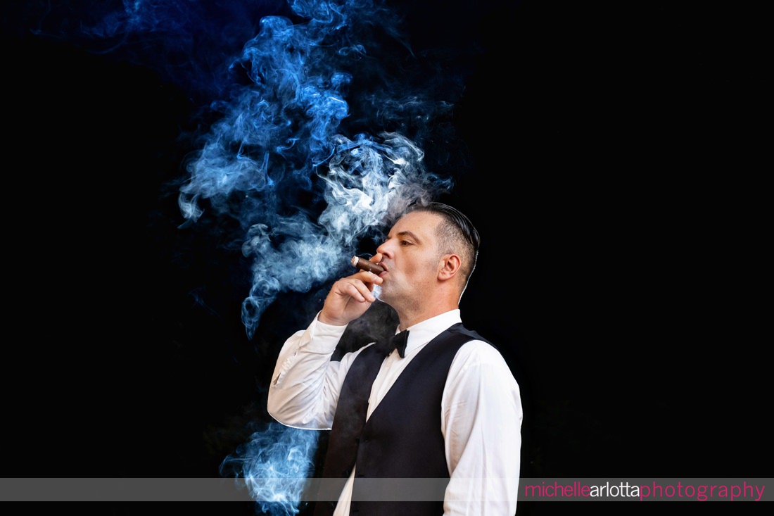 Venue at Winding Hills wedding Montgomery NY wedding reception groom portrait with cigar smoke