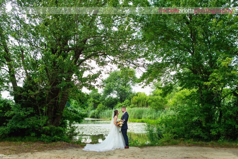 South Jersey Hammonton Backyard wedding bride and groom by a pond