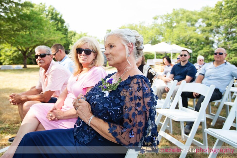 South Jersey Hammonton Summer Backyard wedding ceremony mother of the groom warming the rings