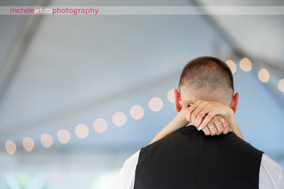 South Jersey Hammonton Summer Backyard wedding reception firs dance detail of bride's hands around groom's neck