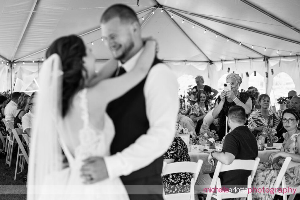 South Jersey Hammonton Summer Backyard wedding first dance mother of the groom taking video in the background