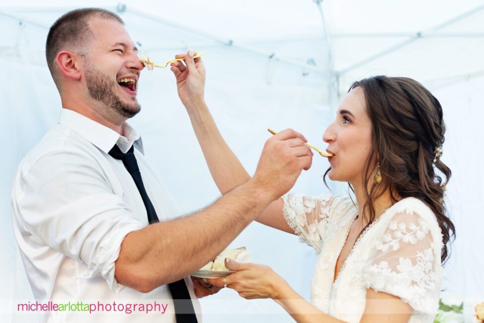 South Jersey Hammonton Summer Backyard wedding reception dancing bride and groom feeding each other cake