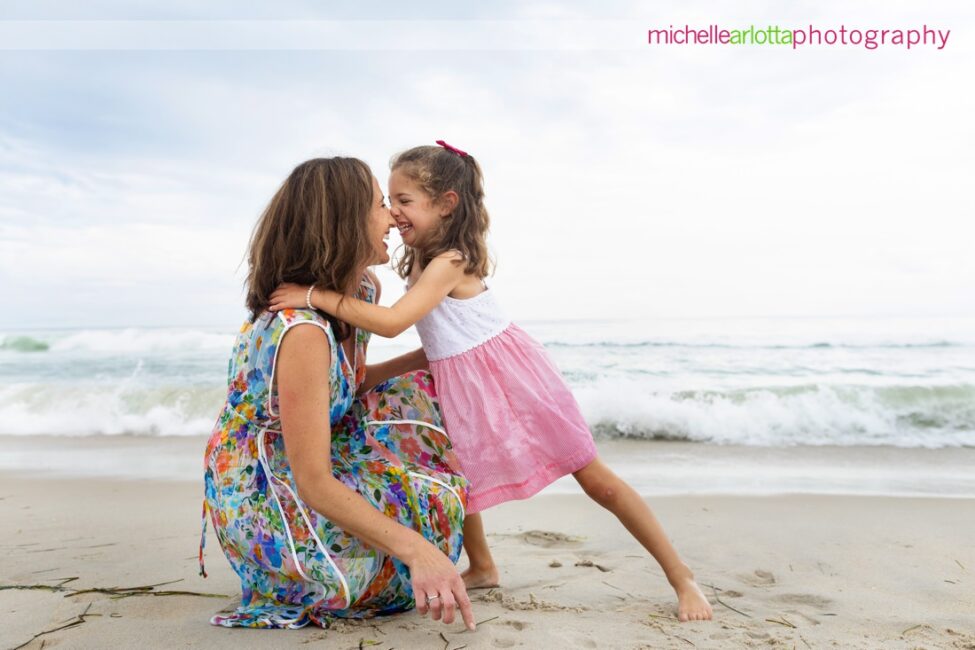 lbi nj family portrait little girl smooshes her nose of up to her mom 