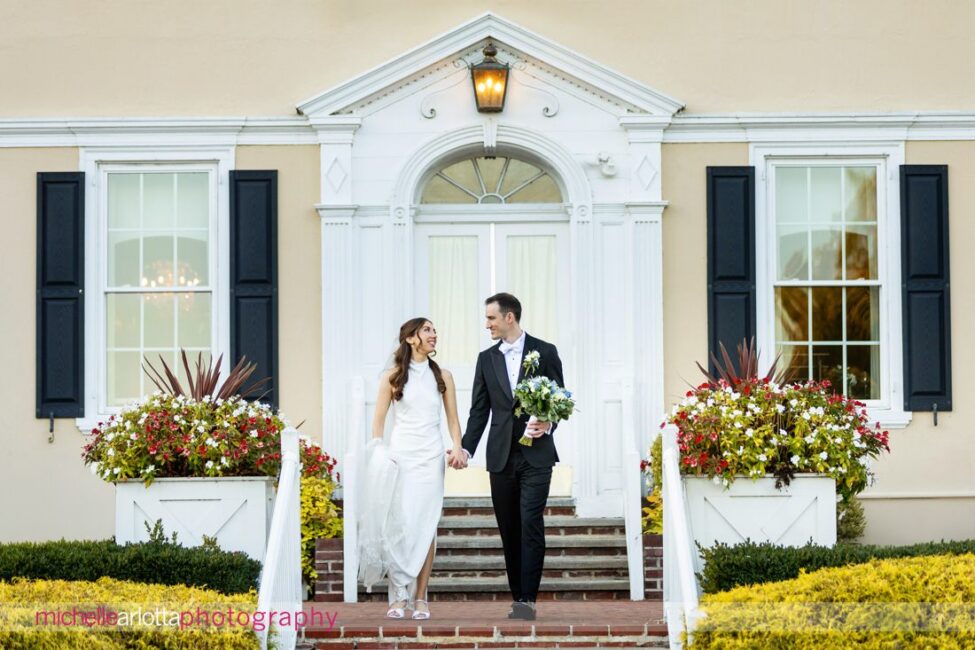 Pen Ryn Estate PA wedding bride and groom walking down stairs in front of estate