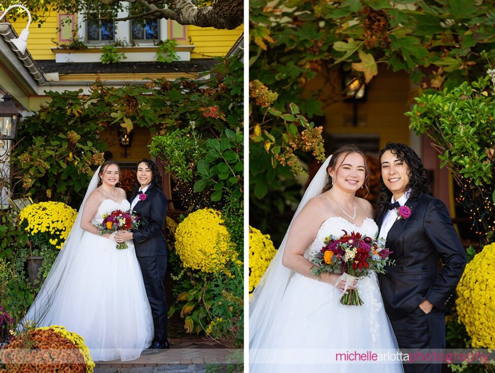 bride in white wedding gown with bride in black suit and bowtie in front of The Gables Inn for their LBI NJ wedding