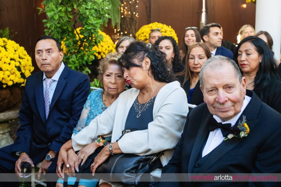 grandmother and aunt get emotional as brides walk down the aisle at late fall gables lbi nj wedding