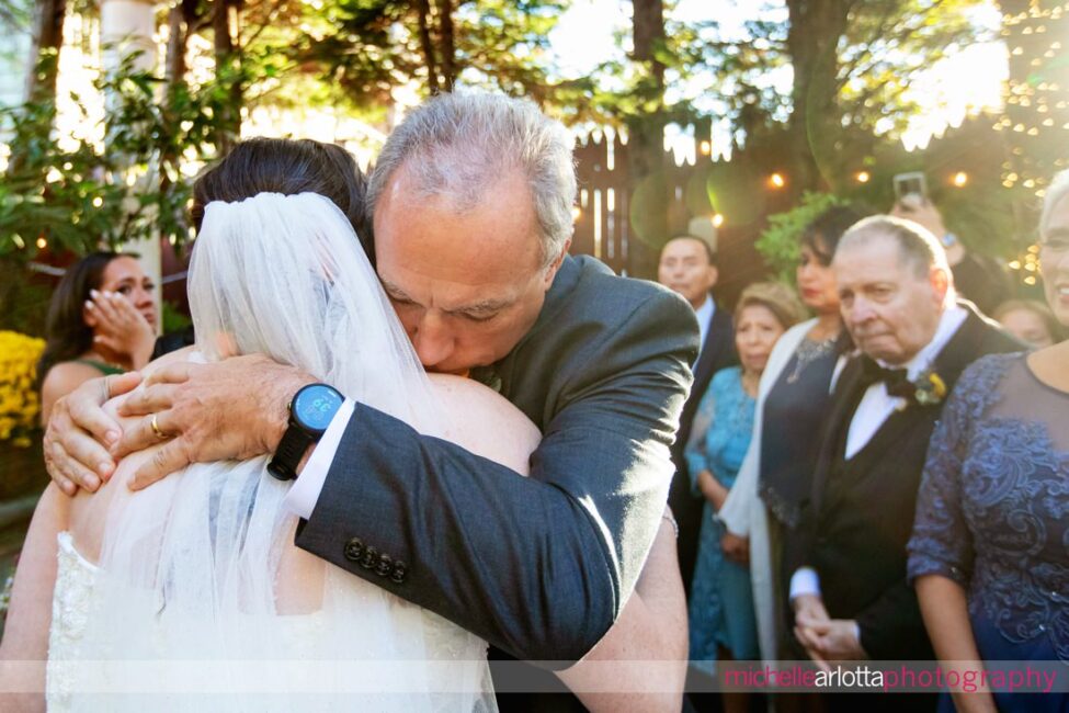 father hugs bride at altar at LBI NJ wedding