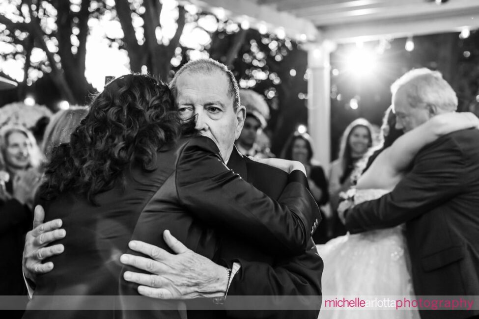 outdoor garden wedding reception two brides share dances with their fathers at LBI NJ wedding