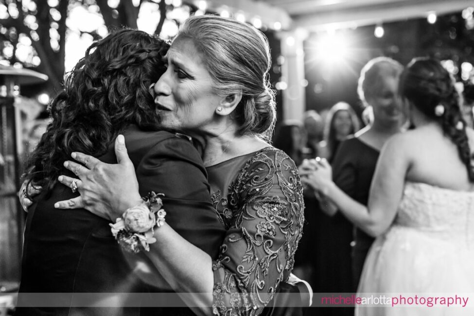 late fall outdoor garden wedding reception two brides share dances with their mothers at Gables Inn LBI NJ wedding