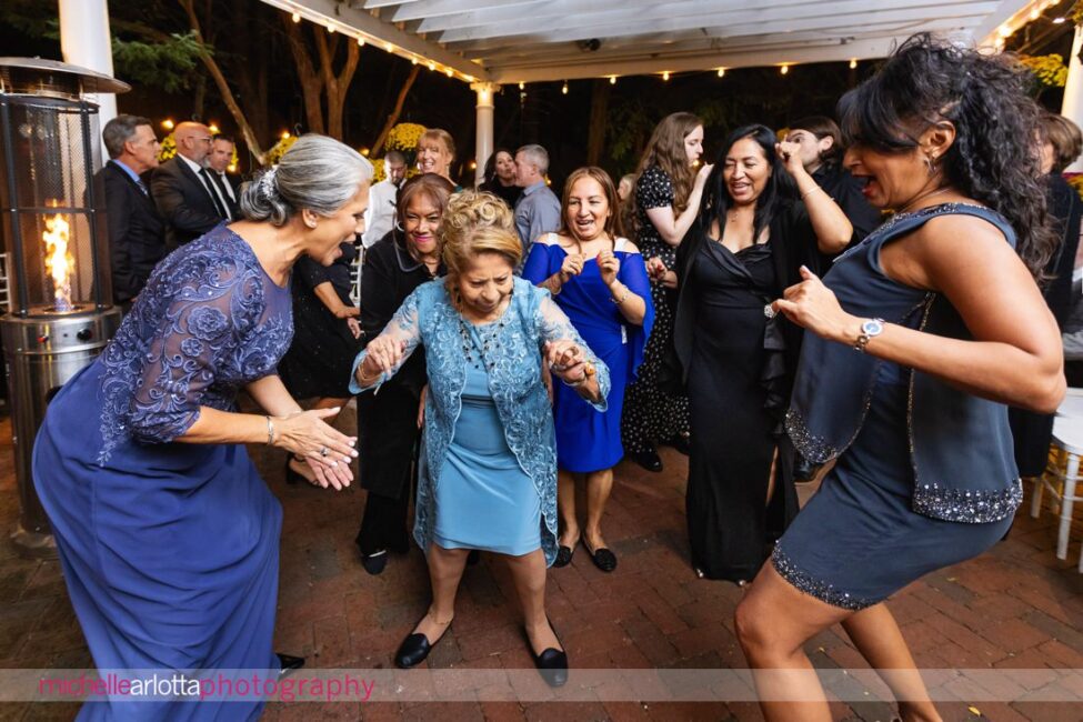 outdoor wedding reception grandmother dancing at late fall Gables LBI NJ wedding