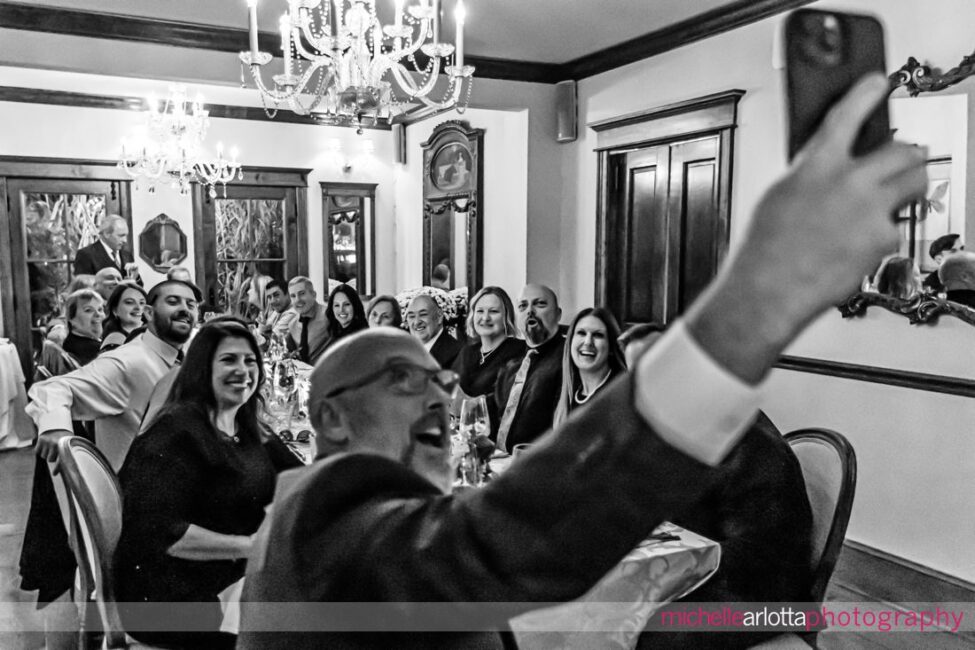 wedding guest takes pic of long table of guests at gables lbi NJ wedding