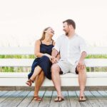 couple laughing on a bench