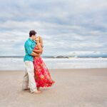 couple kisses on beach haven lbi beach for engagement photos