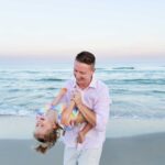 dad and daughter on beach during lbi lifestyle candid family photos