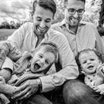 black and white photo of two dad with two sons